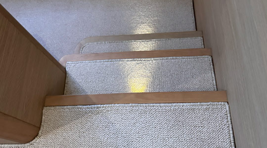 Custom marine carpet and overlocking installation for boat interiors on the Gold Coast.