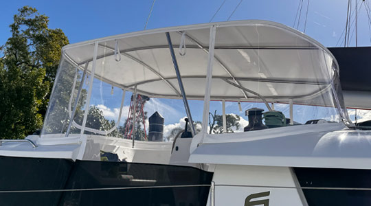 Custom flybridge clears and marine enclosure installed on a luxury vessel at The Boat Works Coomera.